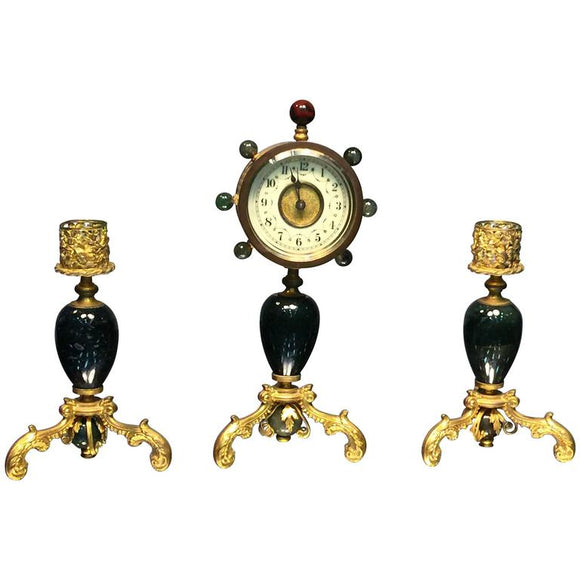 Glamorous Suite of Semiprecious Stone and Doré Bronze Clock and Candlesticks
